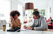 © Bonninstudio/Stocksy - Diverse businesspeople working in cafe