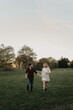 © Chelsea Victoria/Stocksy - A young engaged couple posing for portraits