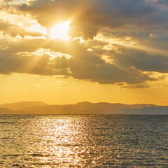 Poster - Sea and clouds with sunbeams