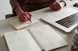 © Guille Faingold/Stocksy - Woman writing notes in her copybook.