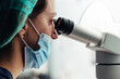 © MyMicrostock/Stocksy - Biologist working on microscope in IVF laboratory