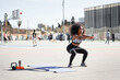 © Guille Faingold/Stocksy - Sportswoman exercising with resistance band.