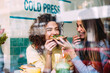 © MyMicrostock/Stocksy - Cheerful woman feeding friend in cafe