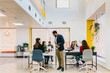 © MyMicrostock/Stocksy - Diverse people in open space office