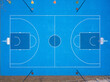 Blue colored basketball court with lines