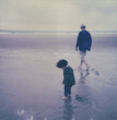 © JImena Roquero/Stocksy - Polaroid photo of a toddler and grandfather at the beach