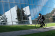 Urban cyclist in rides in business district