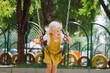 © Tanya Yatsenko/Stocksy - Little girl swinging on a playground