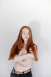 © vradiy.ru/Stocksy - Topless redhead young woman with freckles
