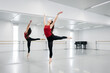 © Sergio Marcos/Stocksy - Young woman dancing ballet near mirror
