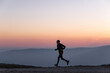 © Hakan & Sophie/Stocksy - man running in sunset