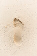 © Andrew Urwin/Stocksy - sand footprint
