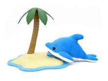 Blue Dolphin Plush Toy Under A Palm Tree On White Background