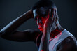 © Manuel Ruiz/ADDICTIVE STOCK - Side view of serious brutal African American athlete in sportswear keeping hands on head and looking at camera with challenge while standing in dark studio with red neon lights