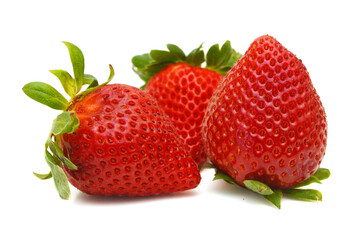 Three strawberry isolated on a white background, macro image