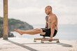© Carlos Rodelas/ADDICTIVE STOCK - Side view of male athlete with muscular torso performing handstand on parallel bars during workout in summer