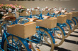© Dennis M. Swanson - Rows of blue classic bicycles with bells, fenders, and wooden baskets on the back