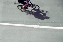 Shadow Of Man Driving Bicycle