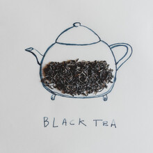 Black Tea And Teapot Concept