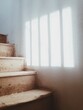 © Bor Cvetko/Stocksy - Old wooden stairs and sunlight on the wall