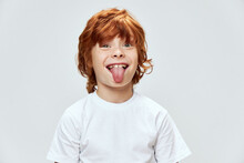 Red-haired Boy Showing Tongue Cropped View Of White T-shirt Fun 