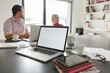© Brkati Krokodil/Stocksy - Laptop Computer With Blank White Screen On The Conference Table