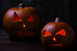 © Darren Muir/Stocksy - Carved Halloween pumpkins.