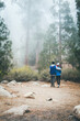 © RZCREATIVE/Stocksy - A couple gazing into a foggy forest.