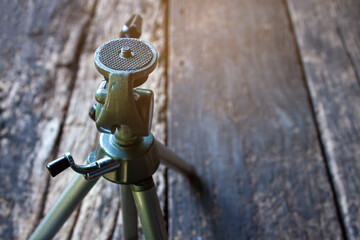 Screw to attach the camera to a tripod. Antique vintage camera tripod.