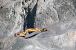 © Per Swantesson/Stocksy - Excavator in a stone quarry
