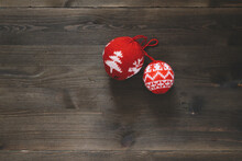 Red Christmas Ornaments On Wooden Floor