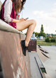 © Jovo Jovanovic/Stocksy - Closeup on young woman checking her phone in a skate park