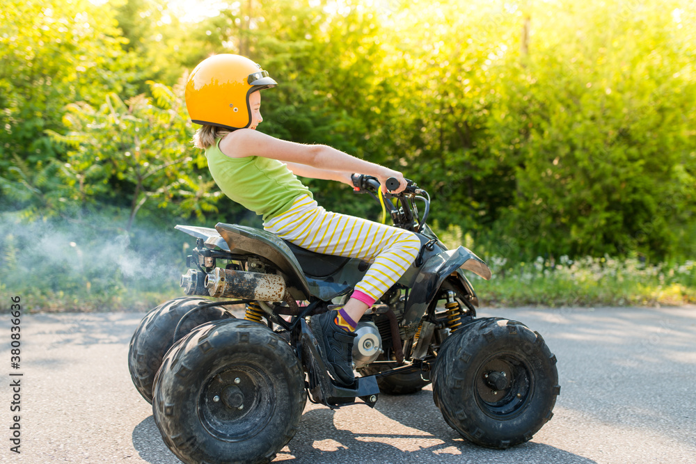 Girl Having Fun Riding Fast Gas Powered Jr Kids ATV Quad On Trail With ...