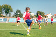 © Lumina/Stocksy - Boy Juggling a Soccer Ball