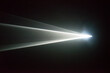 © Trent Lanz/Stocksy - Illuminated beam of light from a projector