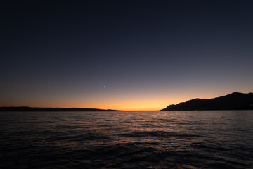 Wall Mural - waves on the sea surface and sky as a background. seascape during sunset. nature composition. medite