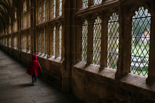 Little Girl Running In Medieval Cloisters.