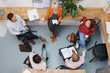 © Aila Images/Stocksy - Group of business people having meeting