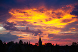 Fototapeta Big Ben - sunset over the church of ratingen homberg with colorful sky
