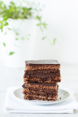 Wall Mural - 
A piece of chocolate cake with mint on white table