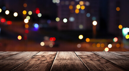 Wooden table, blurred bokeh background background. Neon light, night view, close-up. The general background of the interior, a dark background