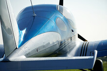 Closeup Of A Blue Single-engine Aircraft In A Field During Daylight