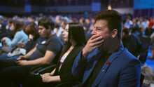 Person Yawn At Business Meet Boring Lecture Speaker. Crowded Audience Asleep. Expressive Face Sleeping Business Man On Forum. People Emotion Yawning At Conference. Auditorium Sleep Tired From Insomnia