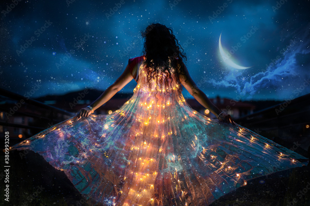 Belly dancer with wings of light under a starry sky - obrazy, fototapety, plakaty 
