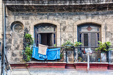 A Balcony With Blue Towels Hanging To Dry In Havana, Cuba