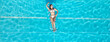 © 4kclips - Sunbathing and tanning in a swimming pool - top down view