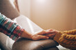 © Erika - Close up view of upset couple, guy holding hands of crying woman, trying to comfort and console her, boyfriend apologizing offended lady, asking for forgiveness. Support, regret and compassion