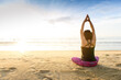 © TinPong - Woman yoga on the beach