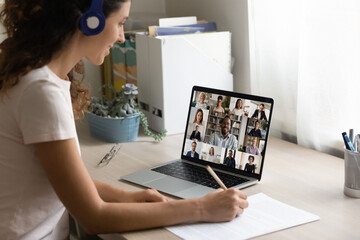 Poster - Close up of smiling female employee have webcam digital virtual conference meeting with multiracial colleagues at home. Woman worker talk on video call engaged in distant briefing with coworkers.