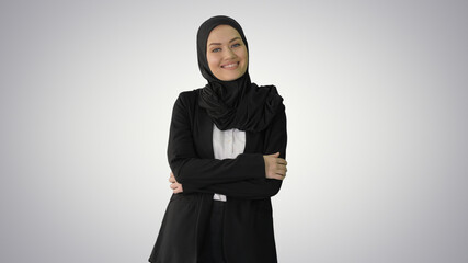 Smiling Arab businesswoman wearing hijab posing for the camera o